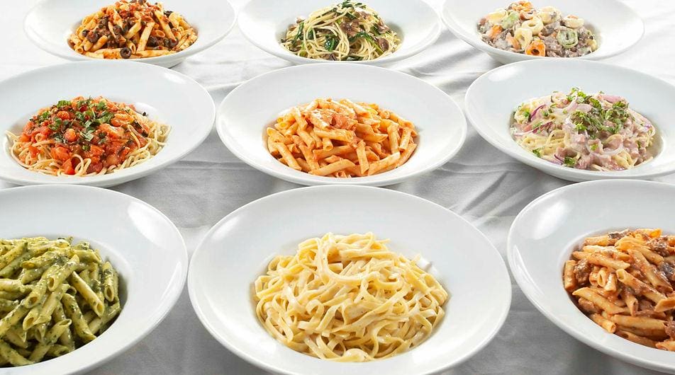 A table with many bowls of different types of food.